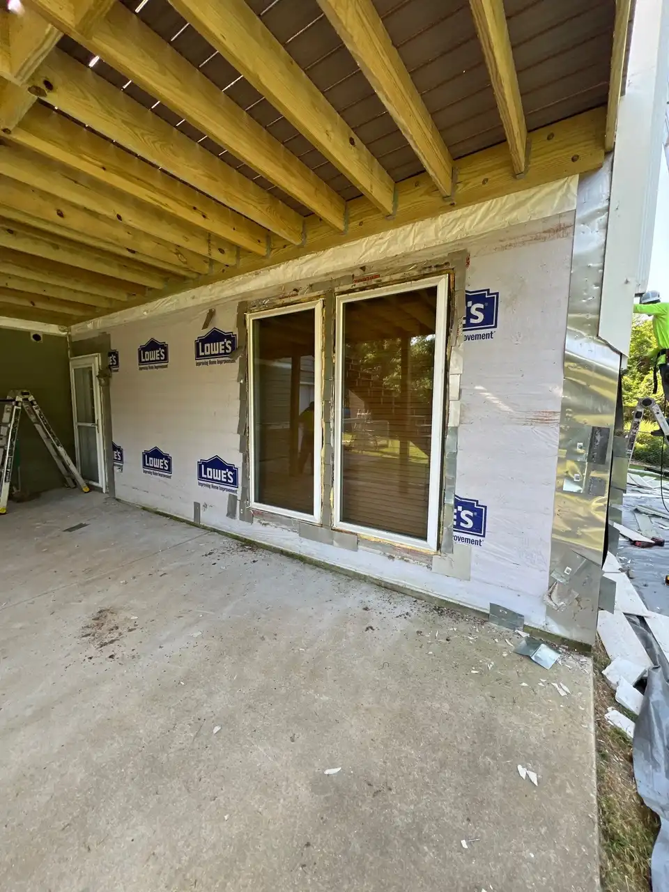 Roofing contractor installing shingles on Missouri home